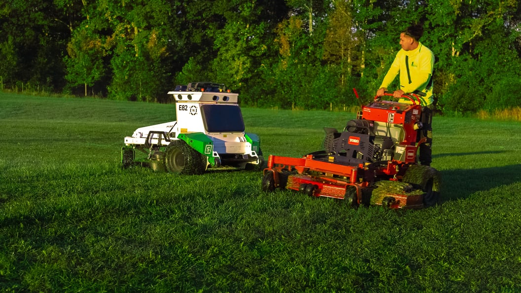 Athletic field robotic mower crew mowing skythe 