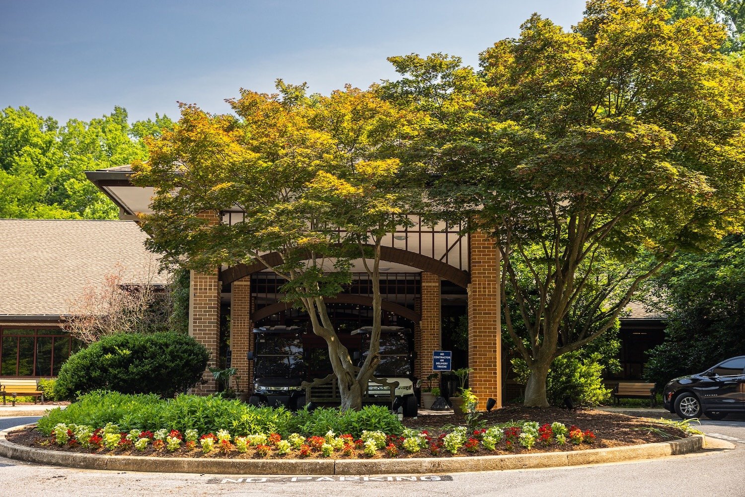 healthy plants and trees at commercial property entrance