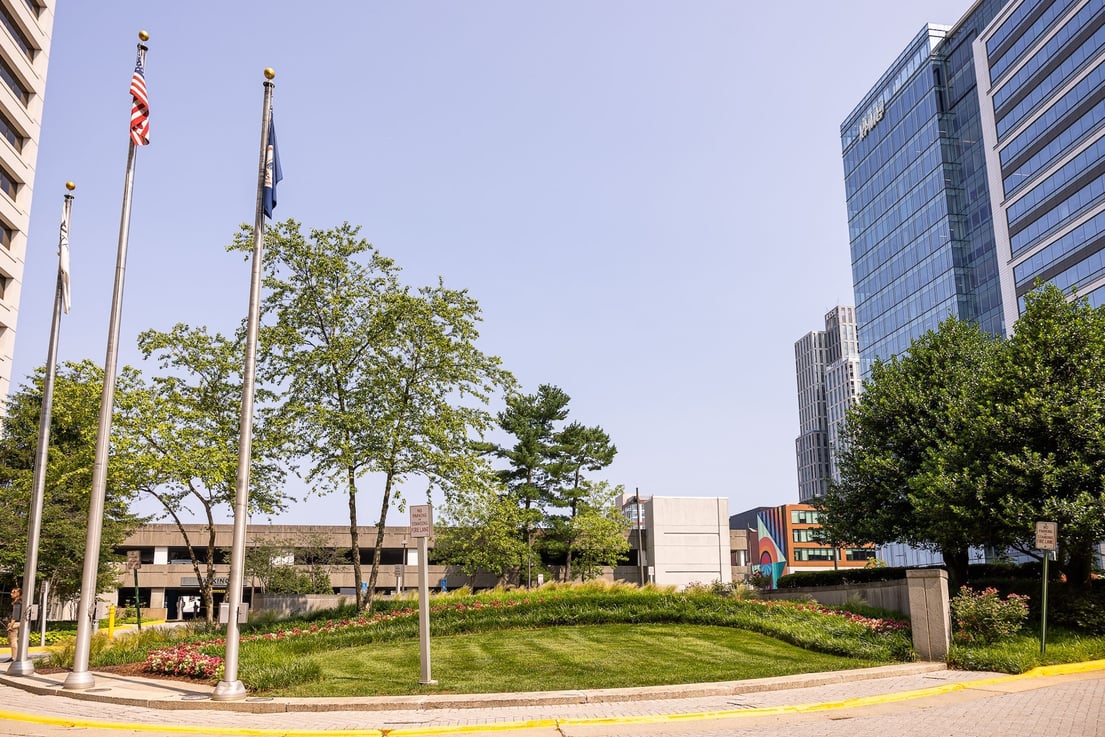 The boro landscape beds green lawn near parking garage 