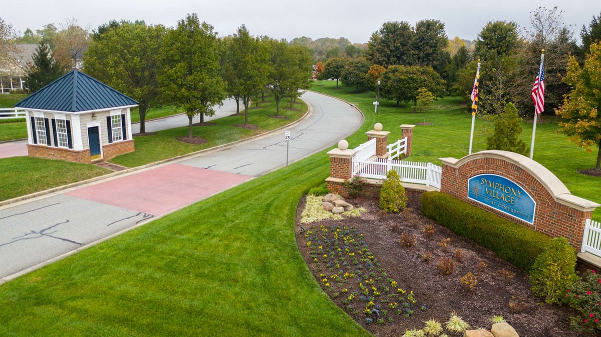 entrance to HOA with flowers and bushes