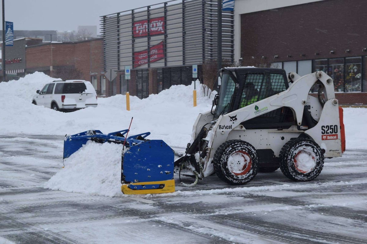 front loader moves snow