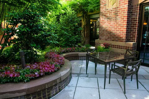 Flowers around patio on commercial landscape