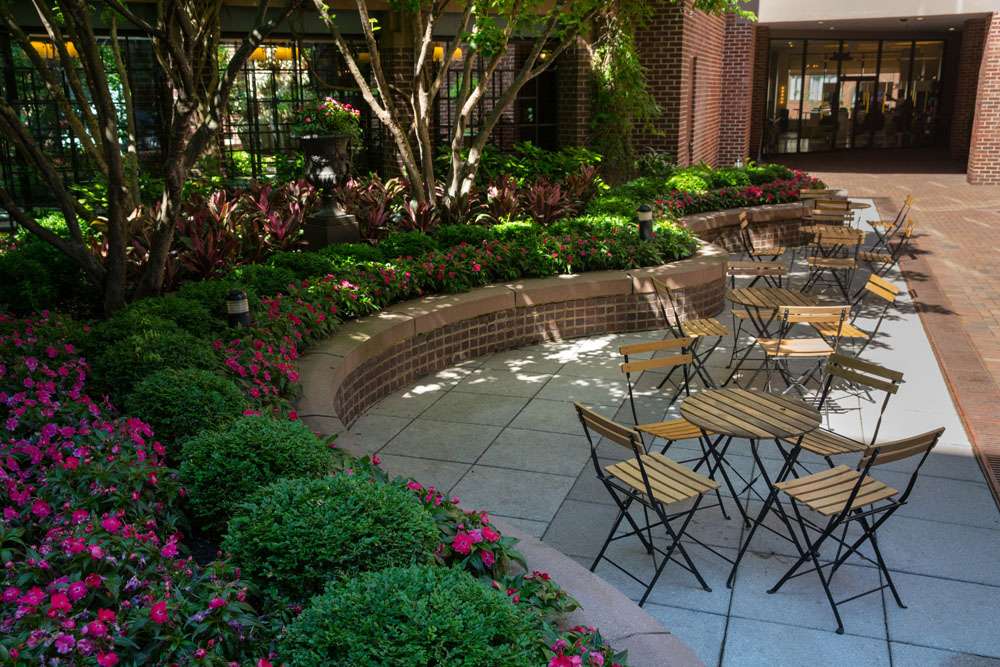 FourSeasons tables seating area common area pavers plantings hotel