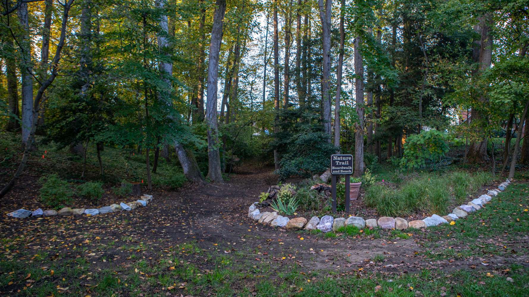 LevelGreen HOA nature trail common area stone boulder edging perennials