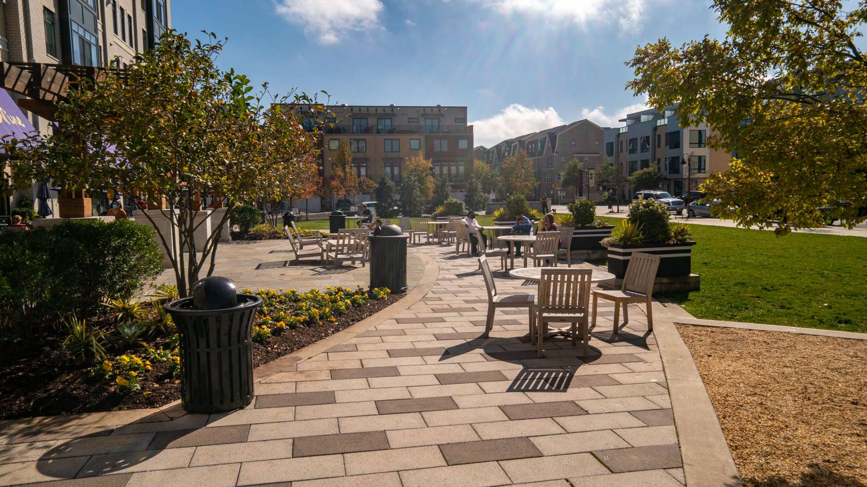 LevelGreen commercial shopping common area seating chairs paver pathway walkway landscaping trees cotainer gardens annual plantings 7