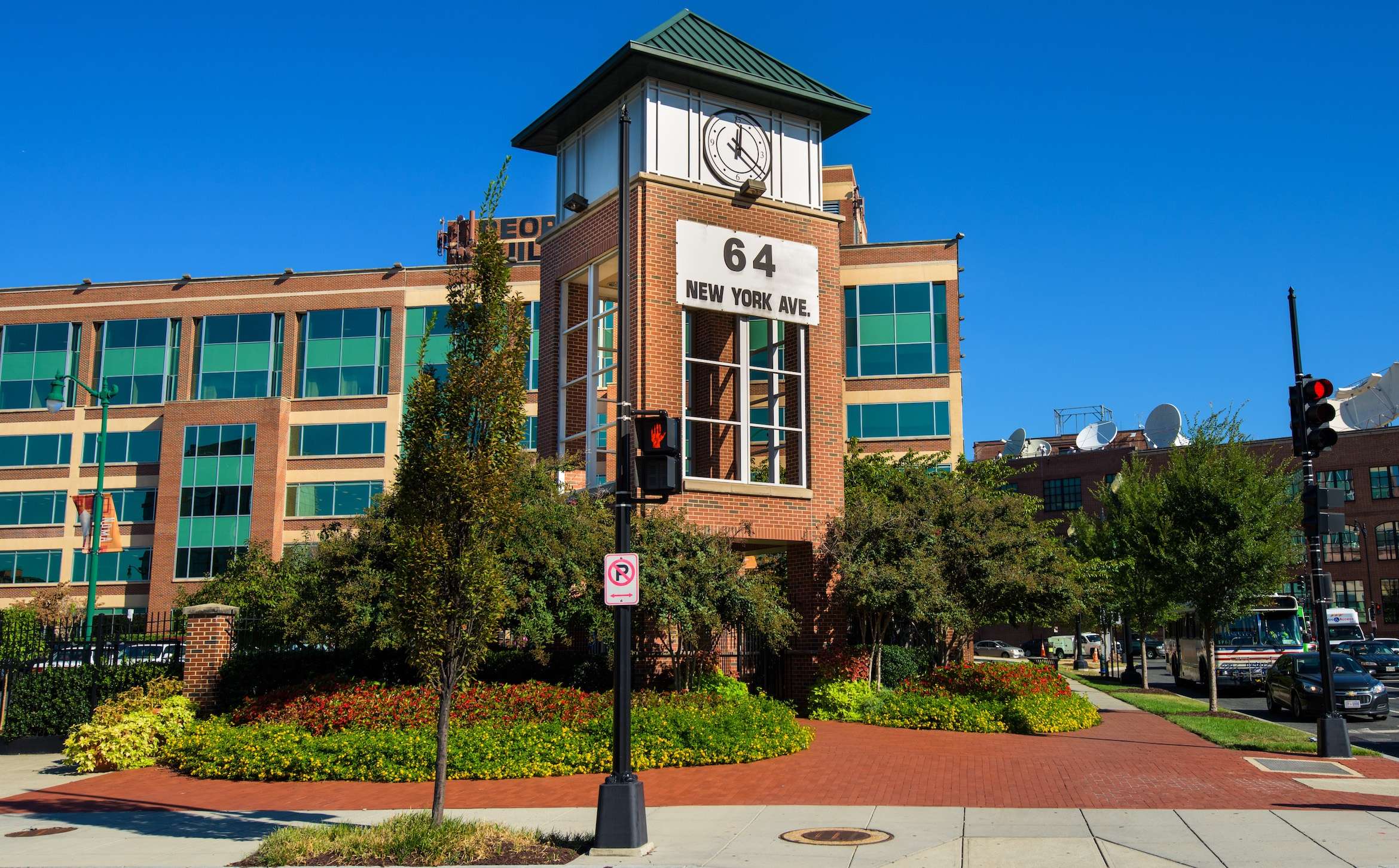 PeoplesBuilding stree corner clock tower sign plantings brick pavers office