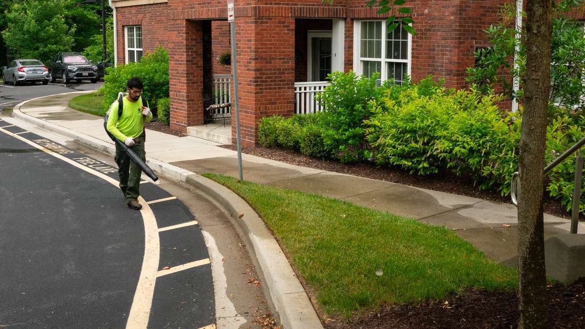 commercial landscaping crew blowing