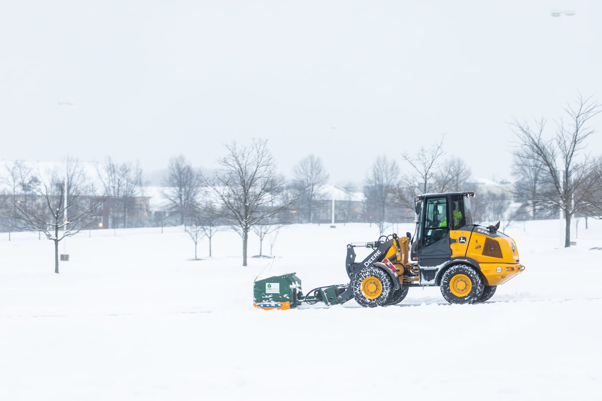 Commercial snow removal crew plowing snow 13