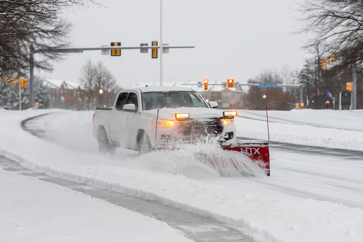 Commercial snow removal crew plowing snow 21