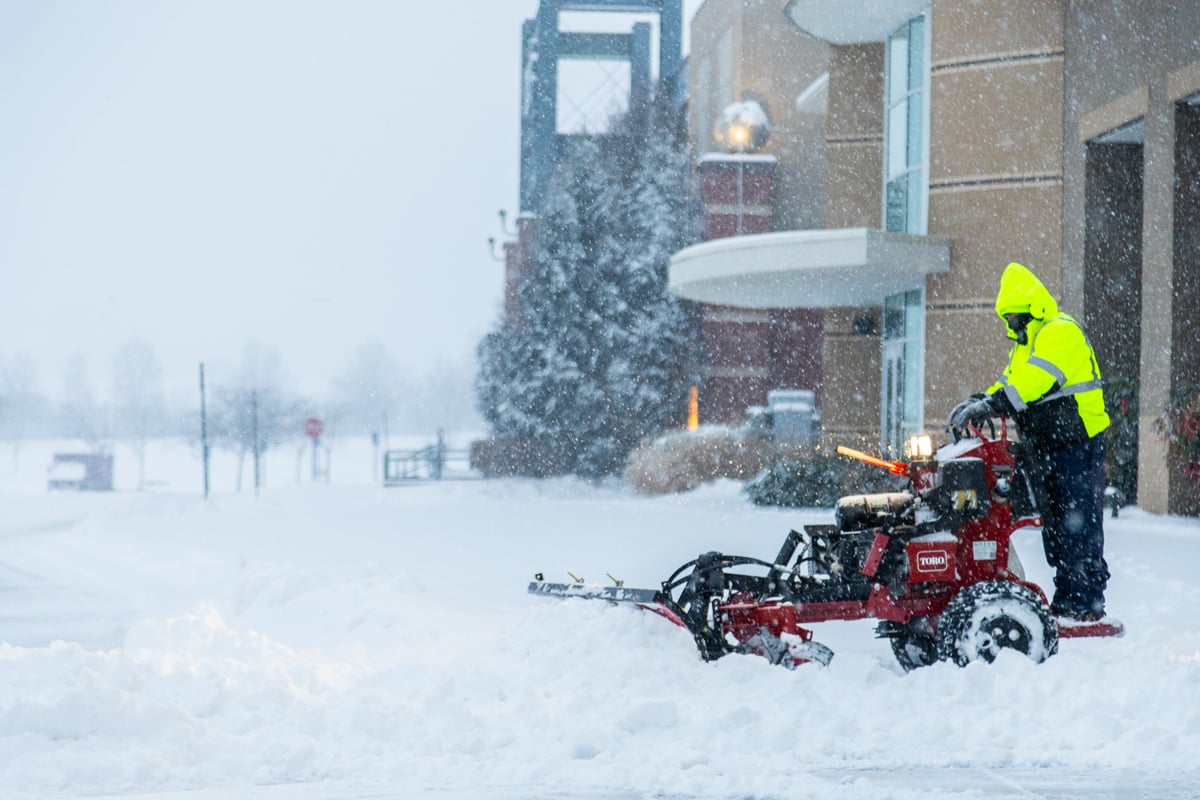 Commercial snow removal crew plowing snow 6