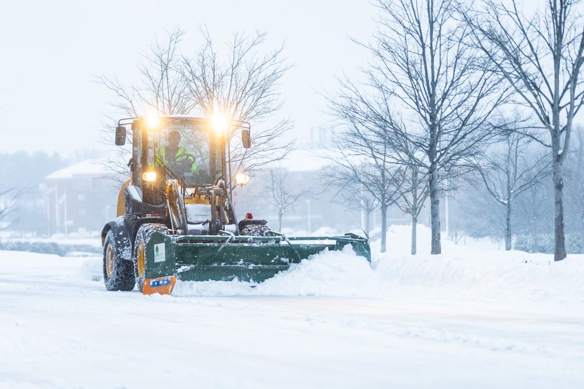 Commercial snow removal crew plowing snow 8