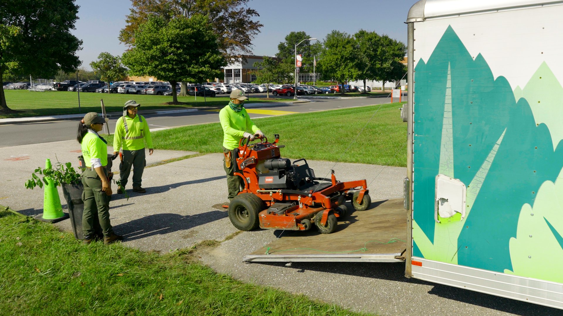 Archbishop Spalding School team crew trailer loading mower