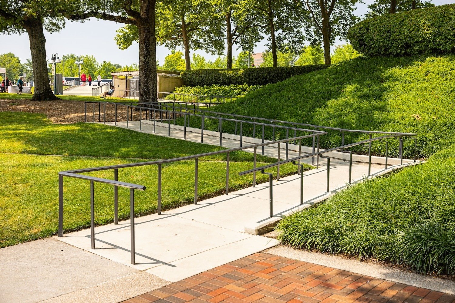 Columbia Lakefront fenced in sidewalk sloped landscape beds green lawn 