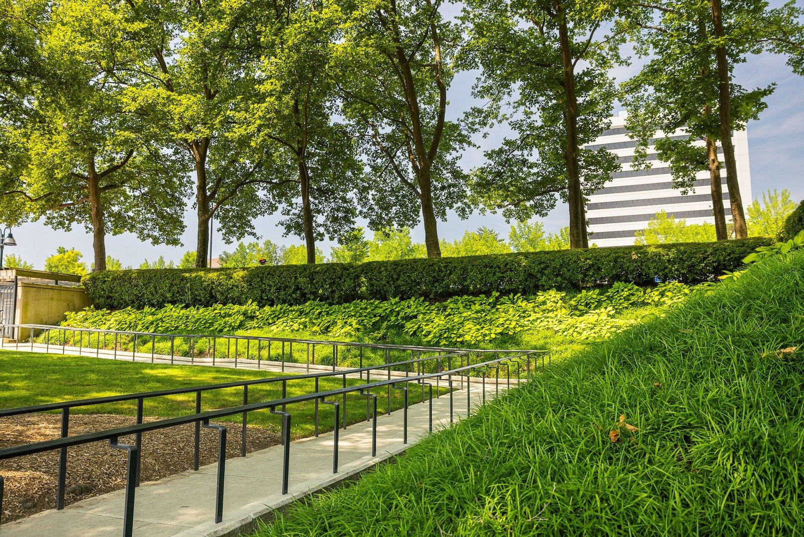 Columbia Lakefront fenced sidewalk sloped landscape beds 