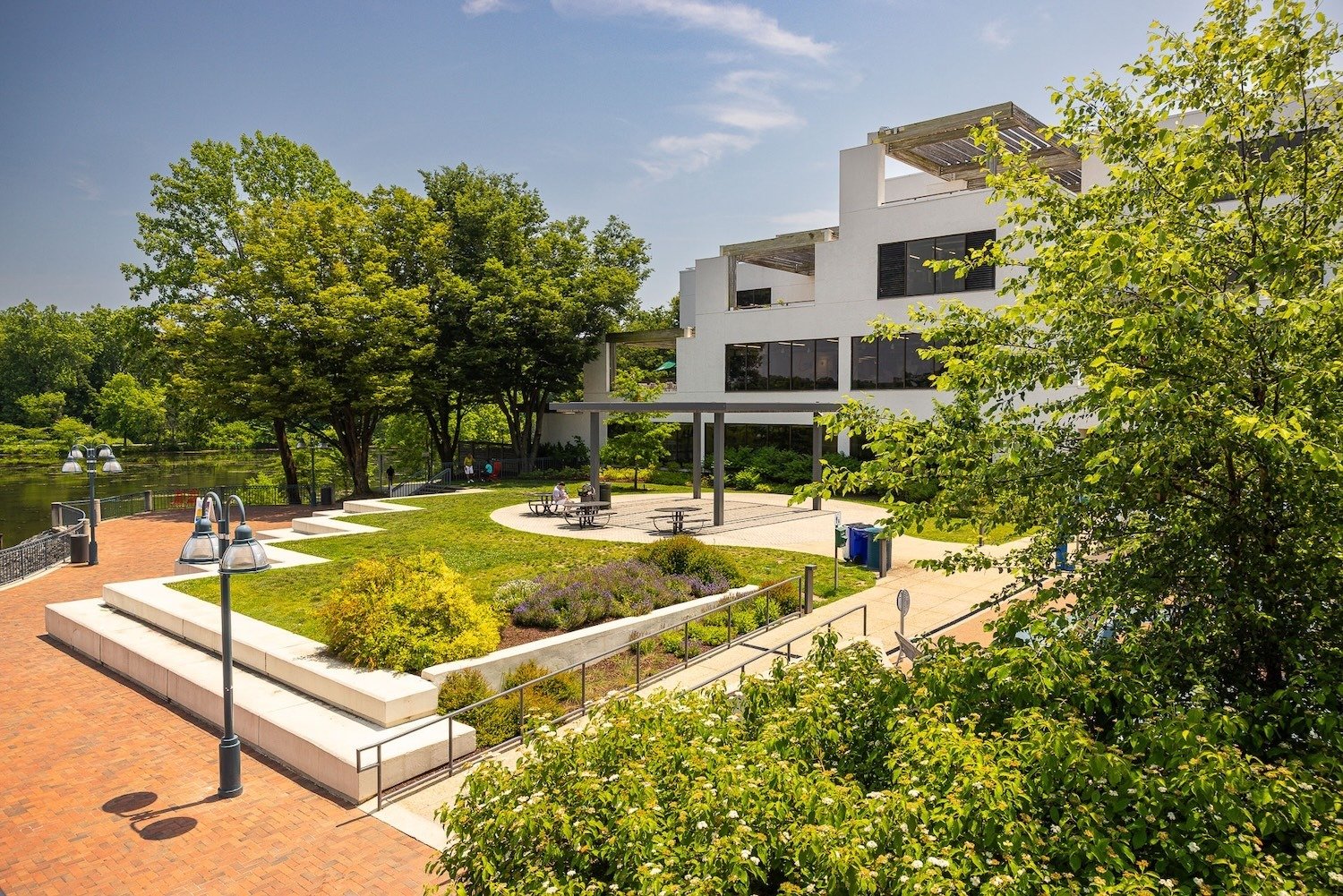 Columbia Lakefront water outdoor seating landscape beds paver walkway