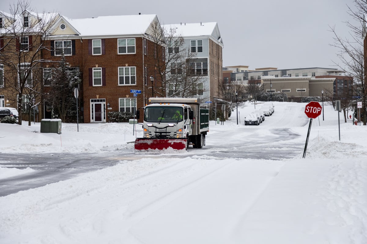 Commercial snow removal crew plowing snow 25