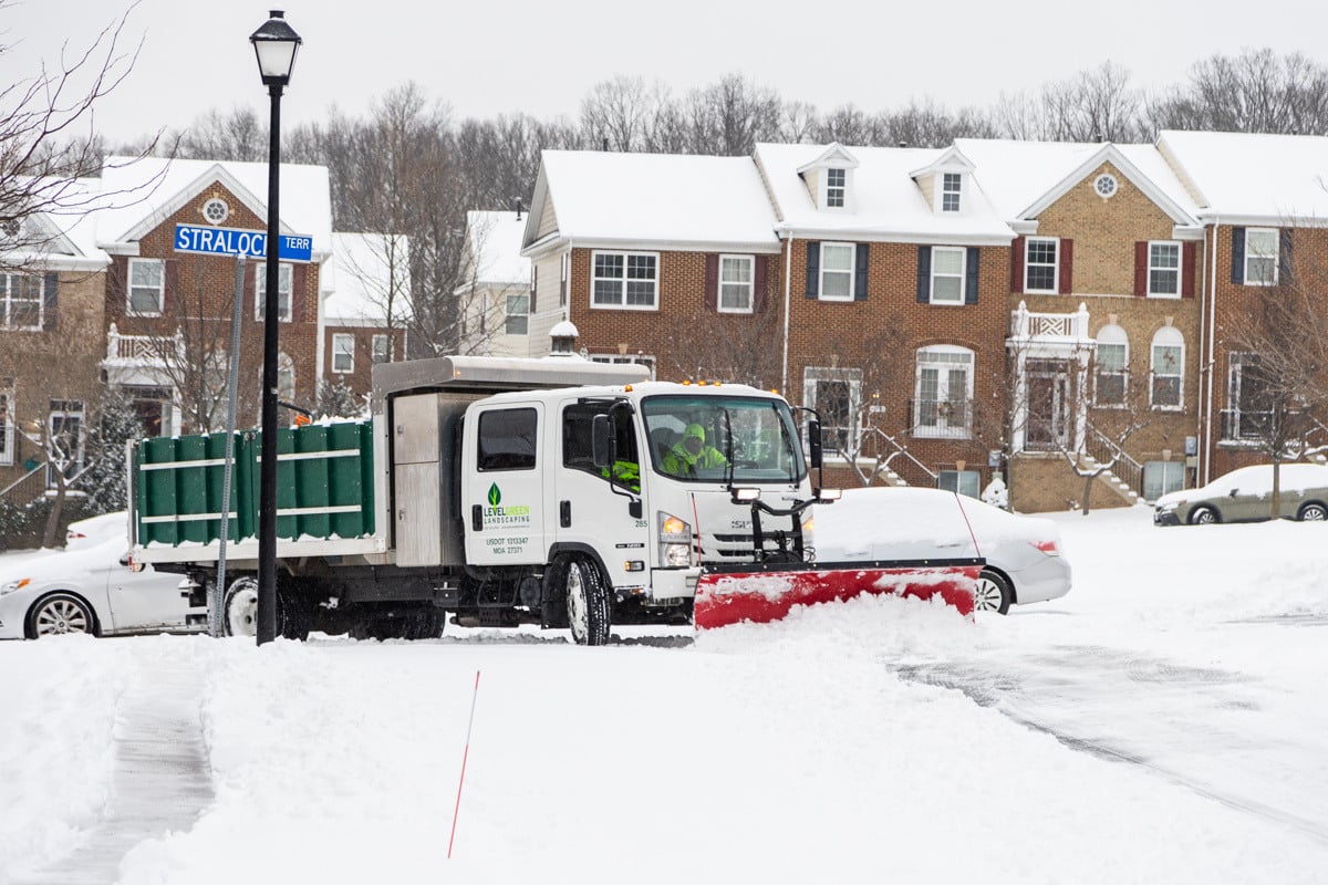 Commercial snow removal crew plowing snow 30