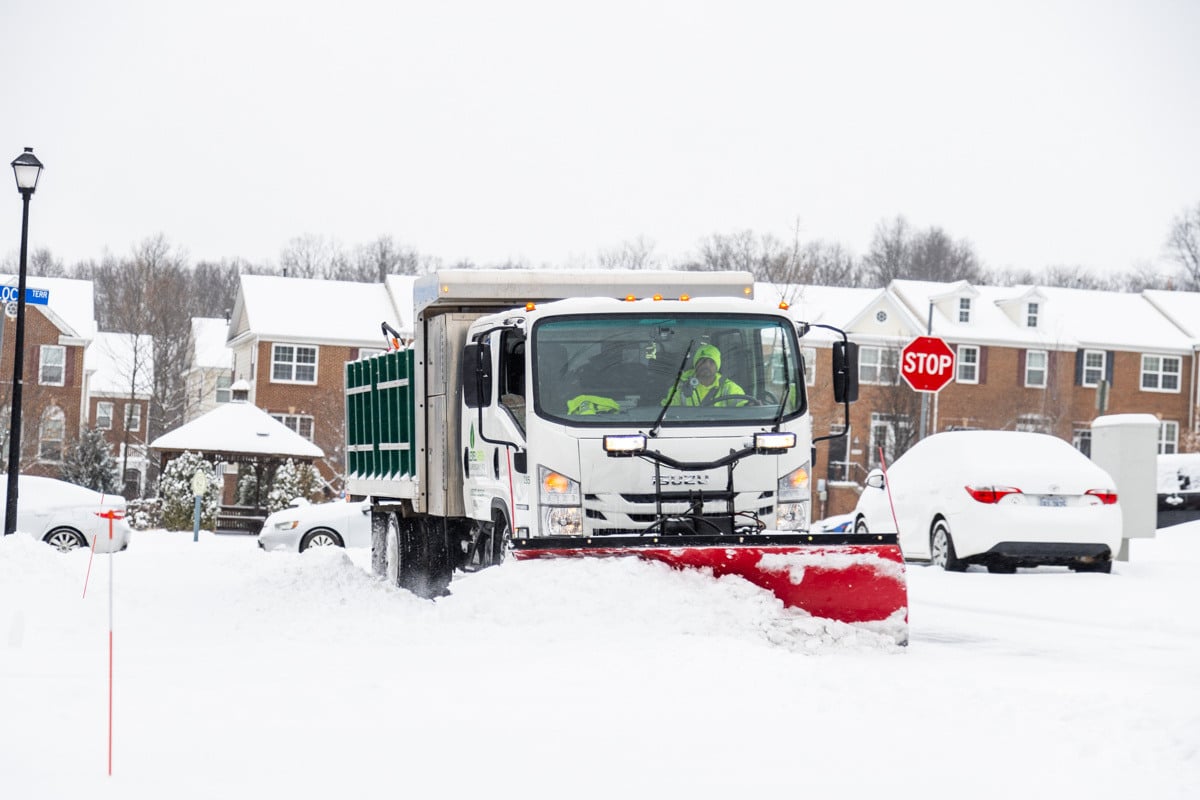 Commercial snow removal crew plowing snow 32