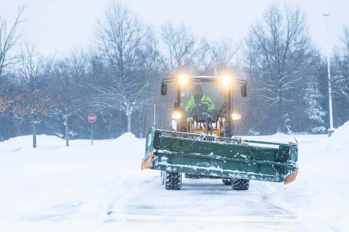 Commercial snow removal crew plowing snow 7