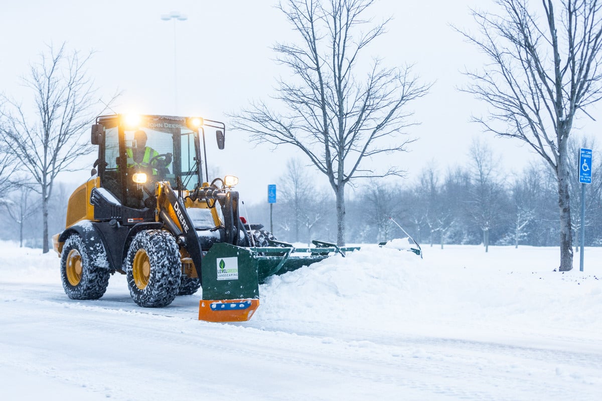 Commercial snow removal crew plowing snow 9