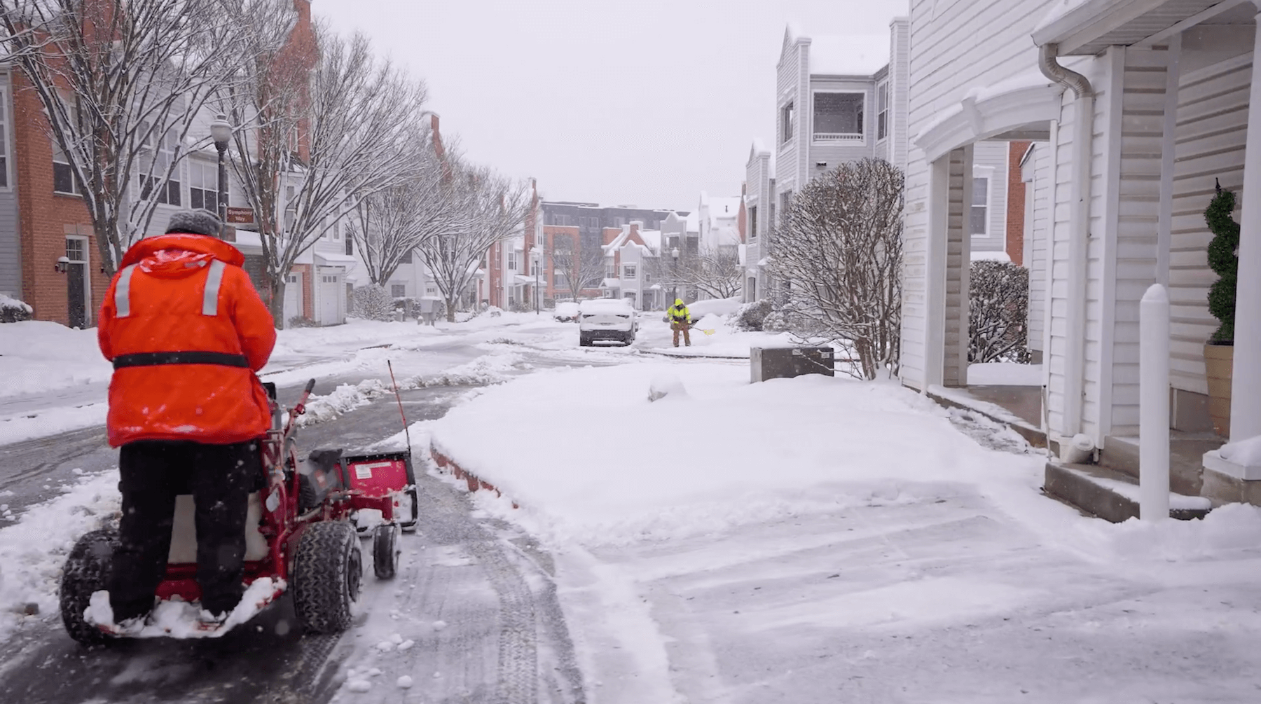 Crew Clearing Snow HOA Community