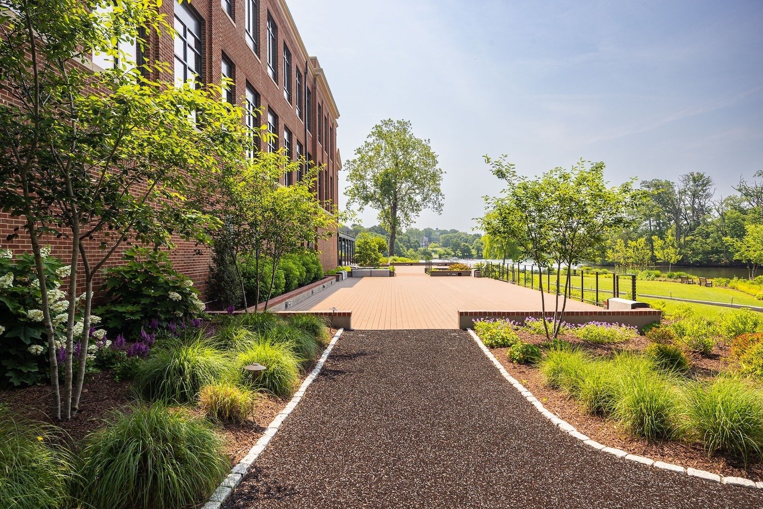 Flugel Alumni Center walking pathway landscape beds deck water 1