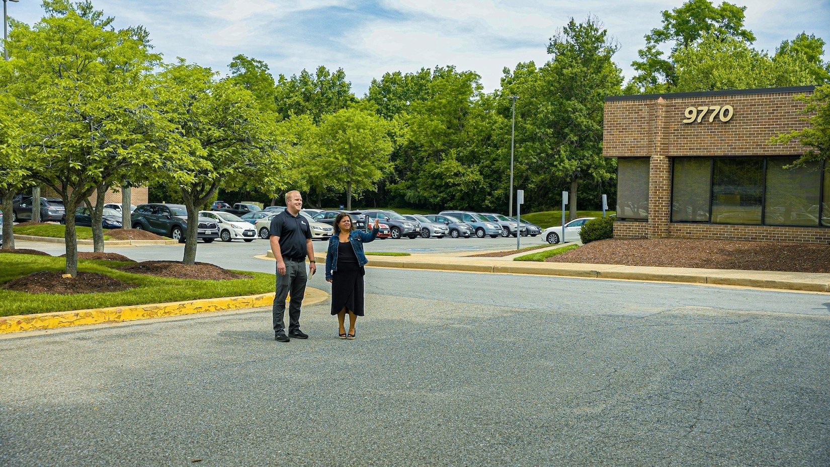 Patuxent Woods account manager and property manager looking at grounds for snow removal 1