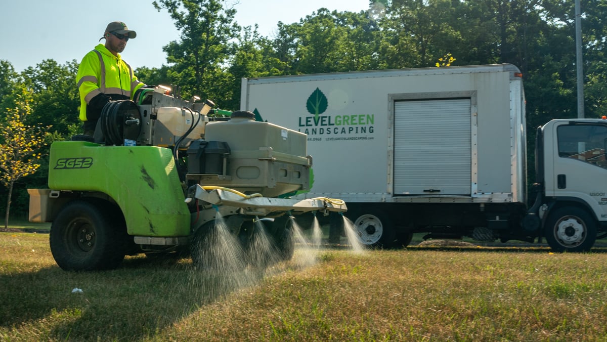 commercial lawn care ride on machine spraying 1