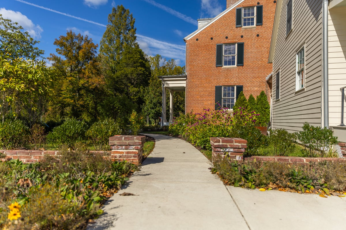 Environmental Research Center side of house garden flower bed area