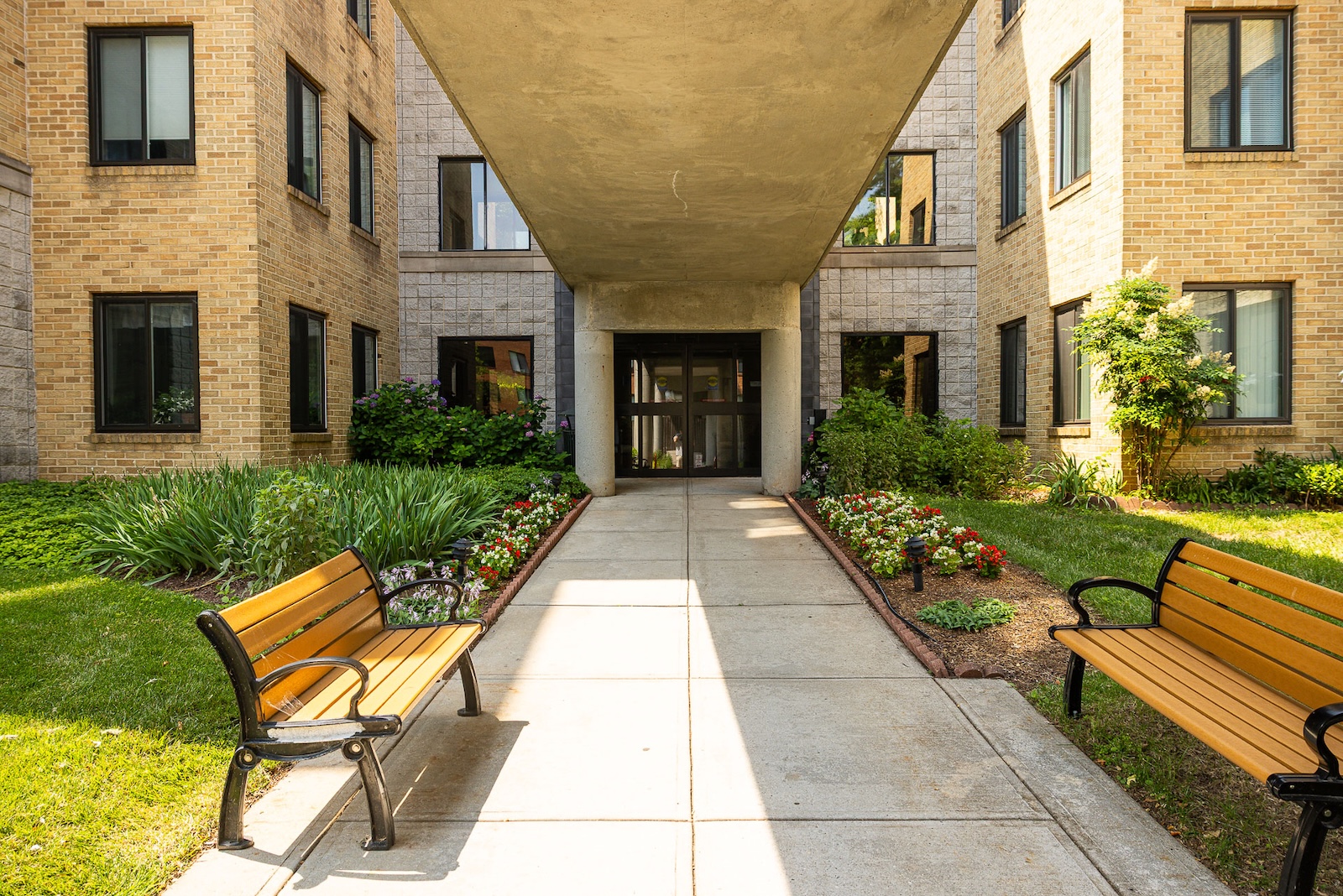 Charleston covered entrance landscape beds outdoor seating 