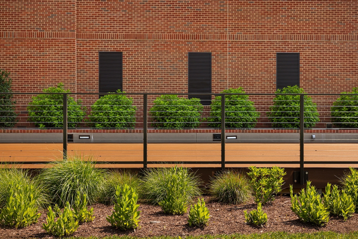 Flugel Alumni Center deck walkway lighting landscape beds 