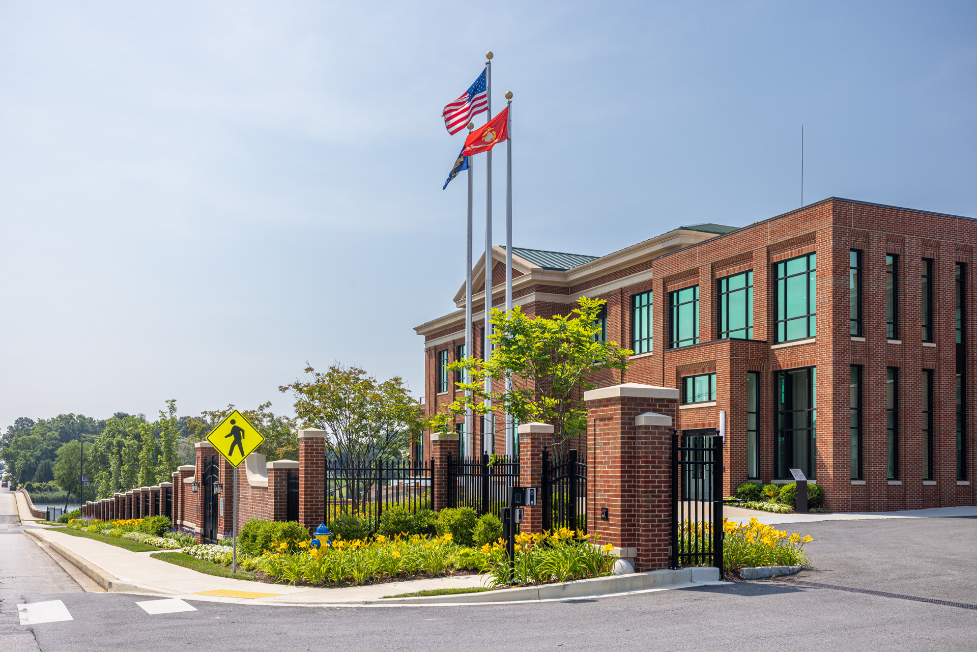 Flugel Alumni Center iron brick fence landscape beds flags