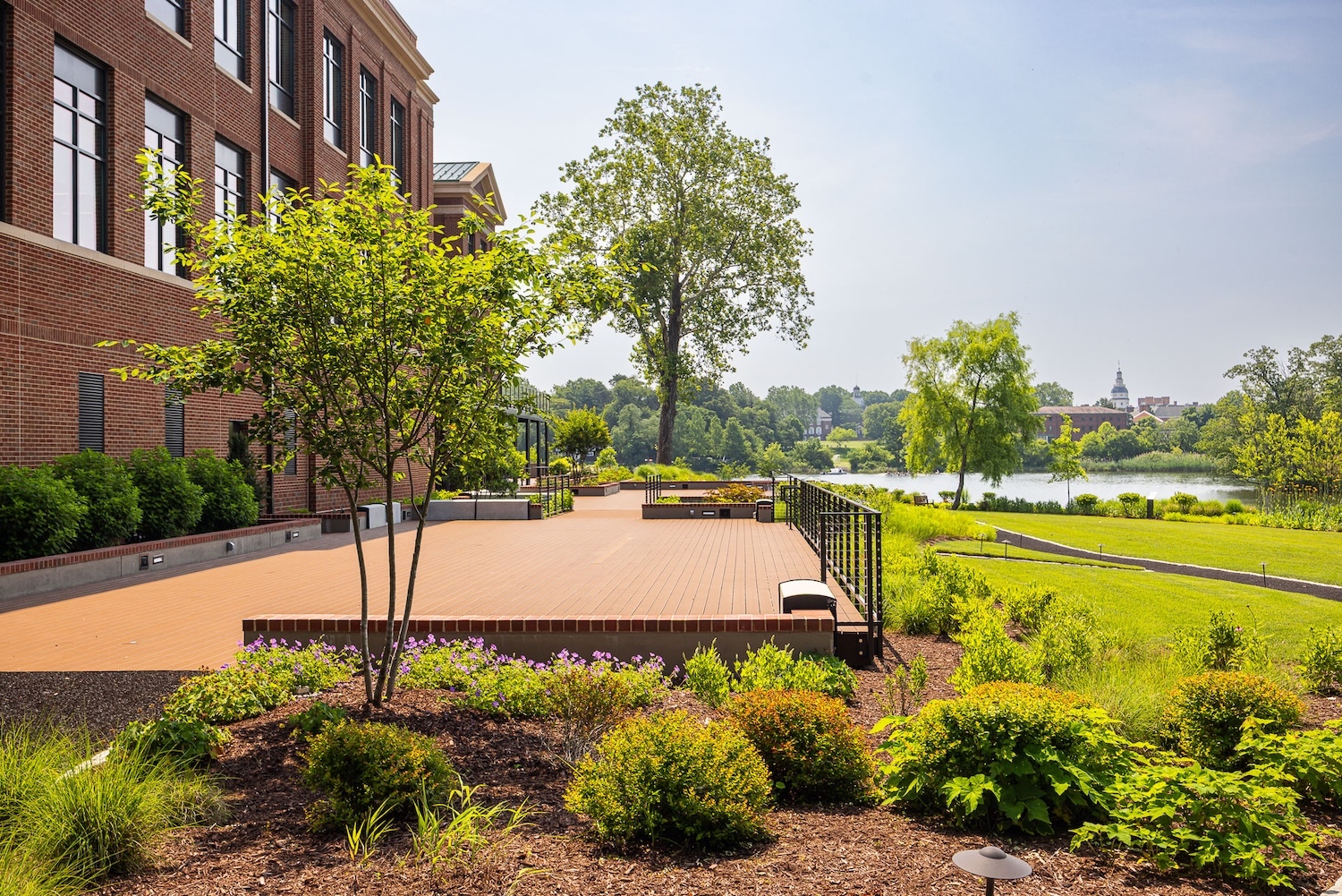 Flugel Alumni Center walking pathway landscape beds deck water 