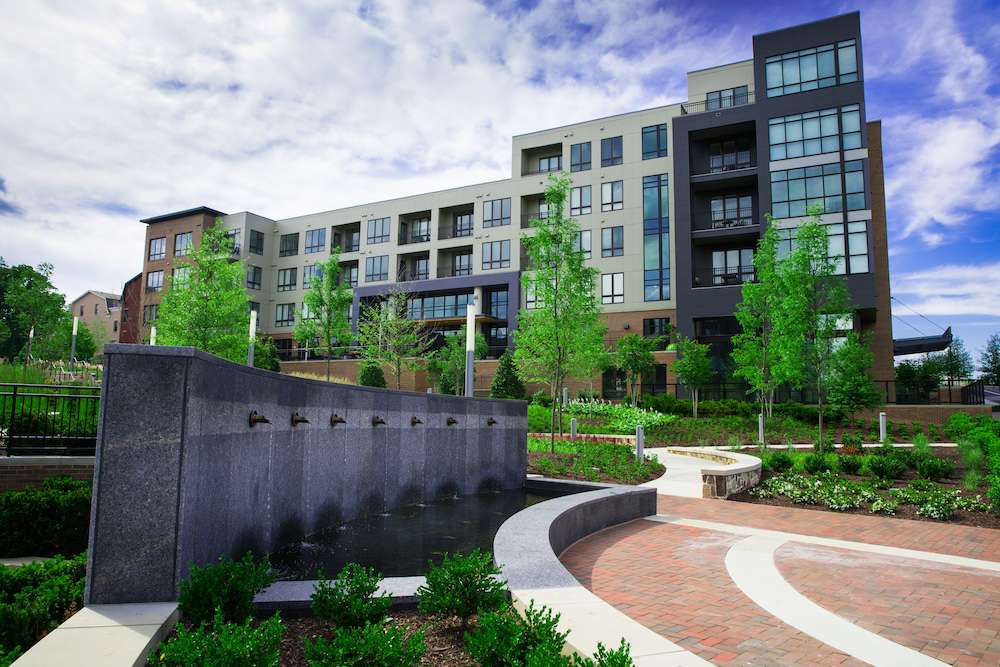 mixed-use water feature walkways plantings mulch flowers