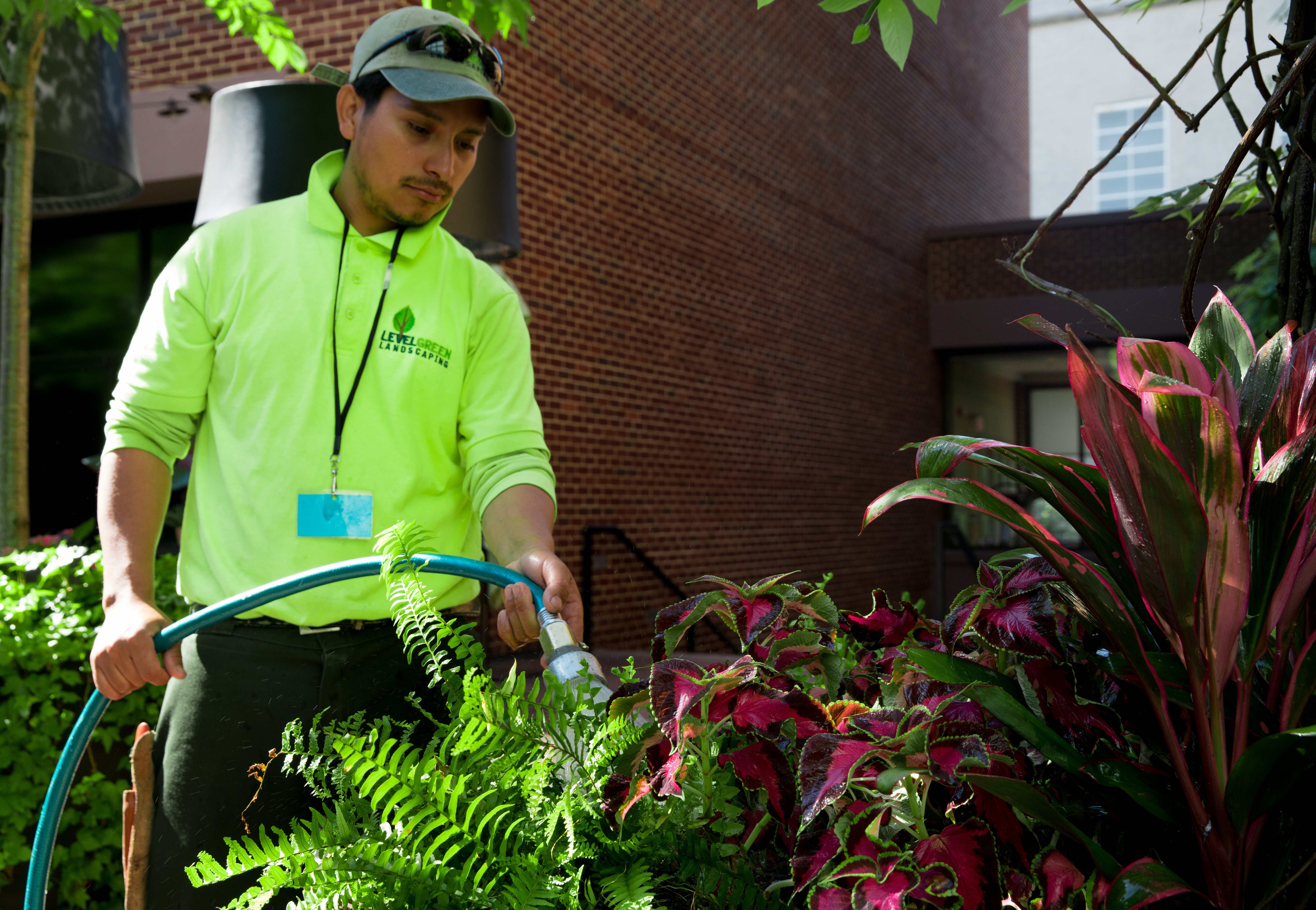 landscape maintenance team water planter