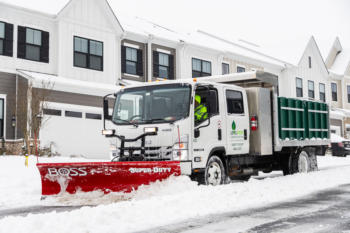 Commercial snow removal crew plowing snow 43