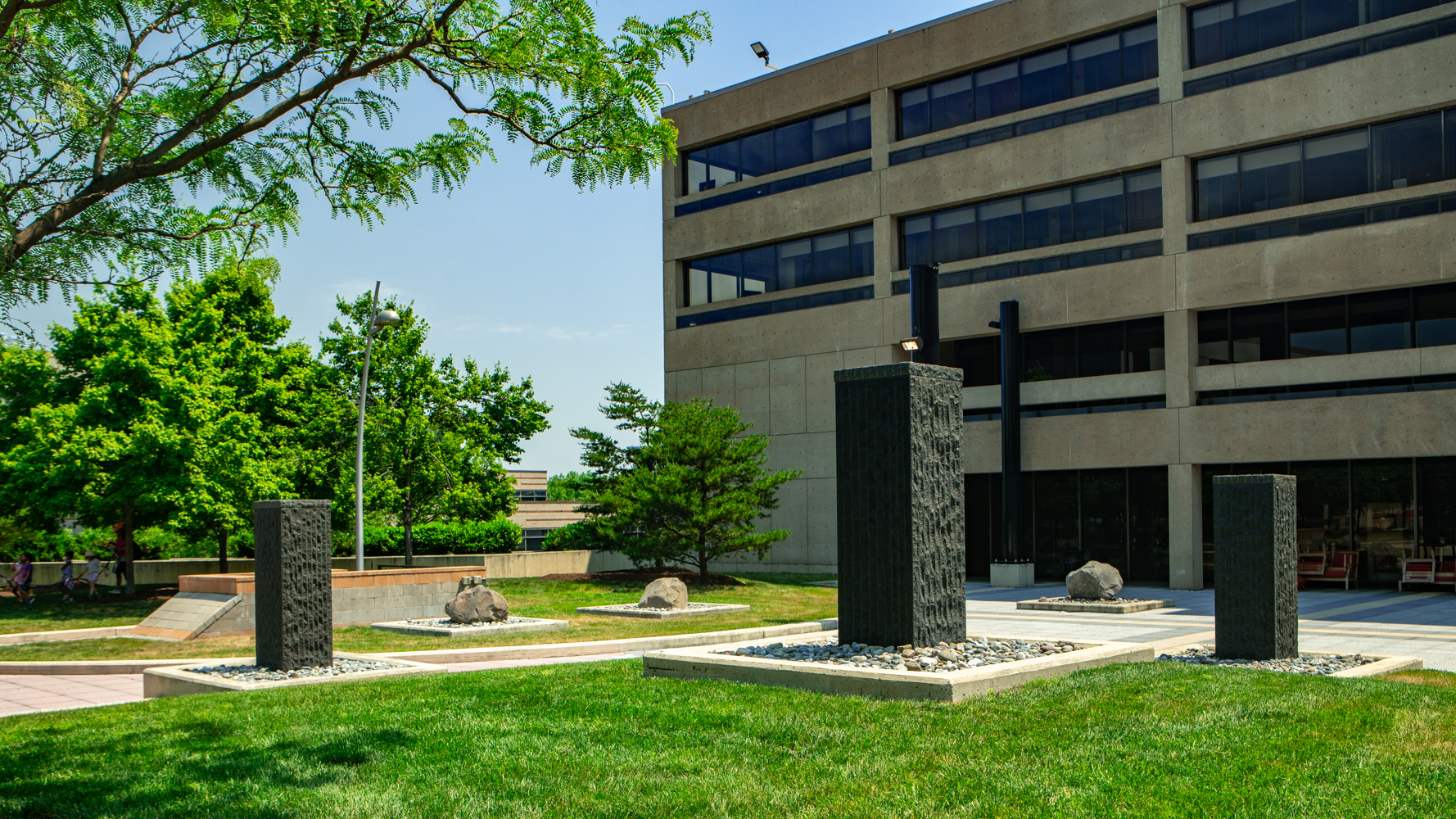 Commercial landscaping Howard University Hospital lawn, pillars, boulders, rocks, trees 2